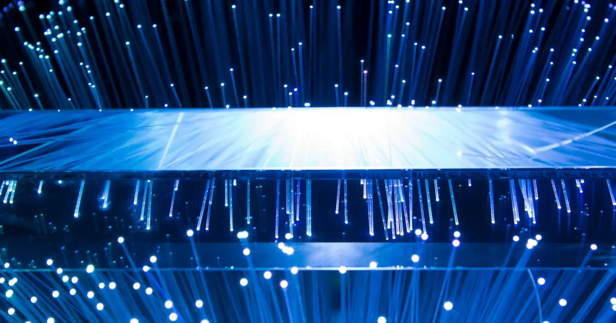 a large display of blue lights in a dark room